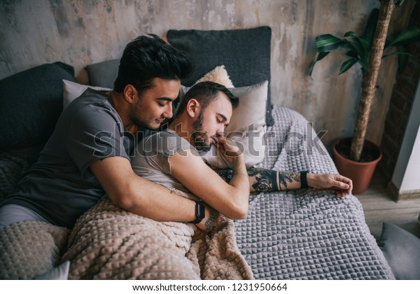 homosexual-nontraditional-gay-couple-cuddling-600w-1231950664.jpg