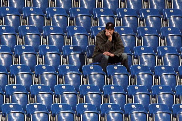 man-sitting-alone-in-empty-stadium.jpg