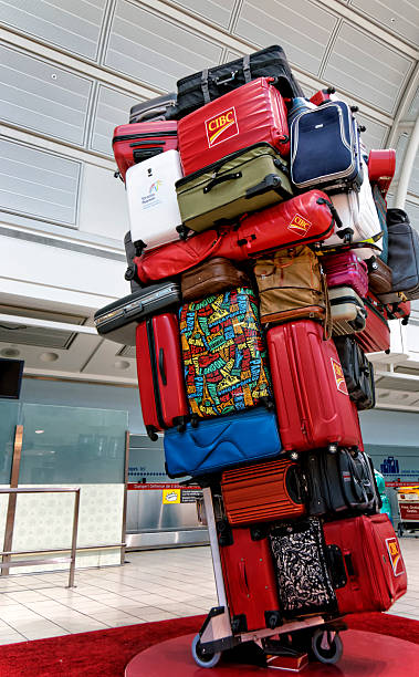 pyramid-of-luggages-on-a-trolley-picture-id523380543